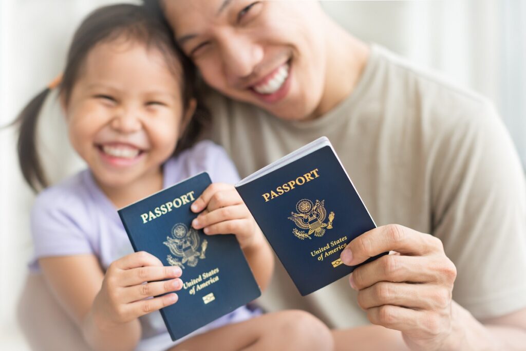 father and daughter show passports and how to get u.s. citizenship