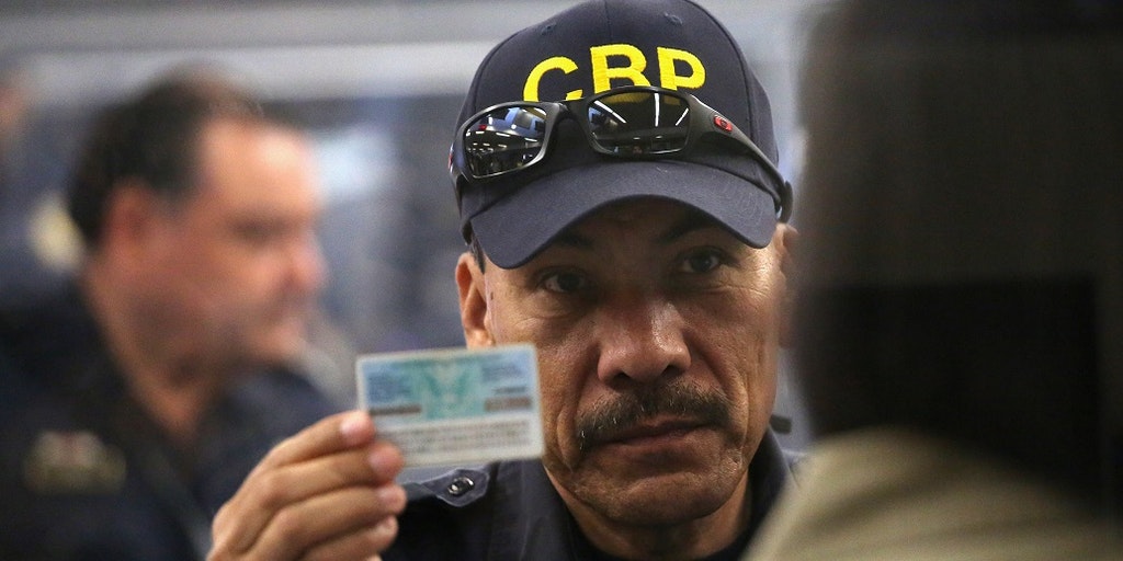 CBP officer holds expired green card at a port of entry