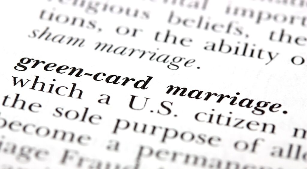 Photo of printed book page the defines green card through marriage