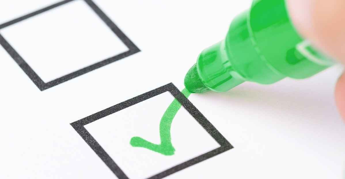Pen marking the N-400 document checklist for naturalization